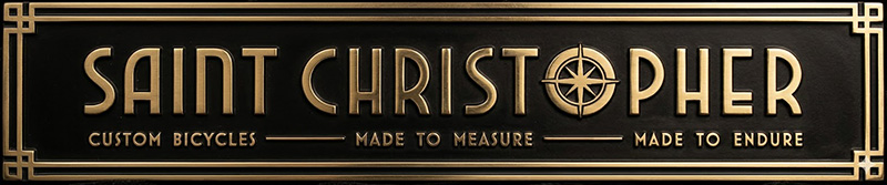 Saint-Christopher-header-logo-messing Saint Christopher naamlogo messing